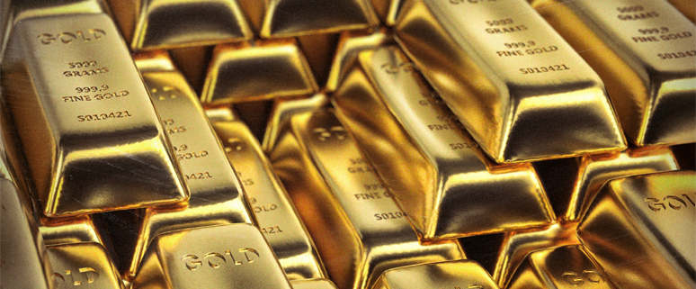 Stapel von glänzenden Goldbarren mit eingeprägtem Gewicht und Reinheitsgrad.